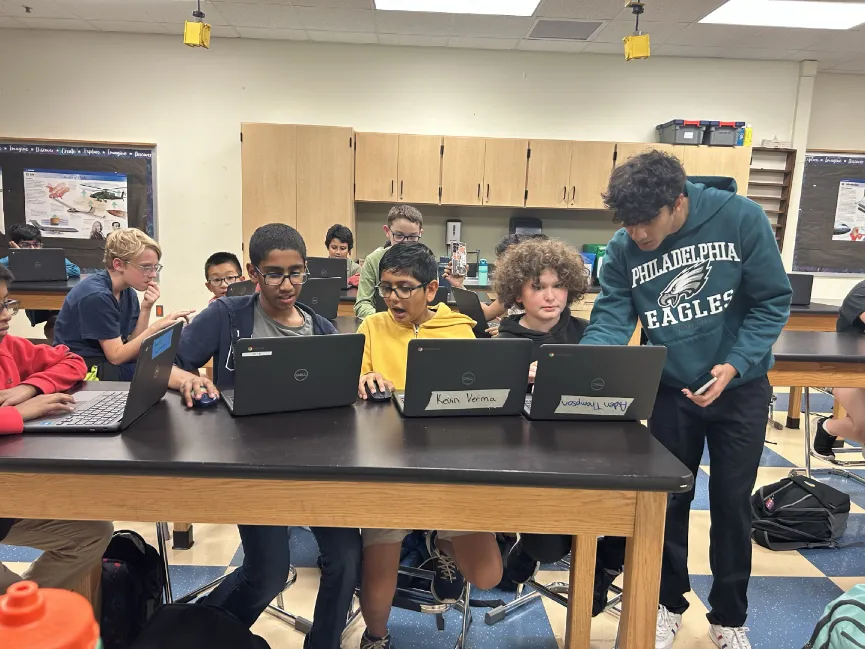 Students collaborating on laptops during CircuitSavvy